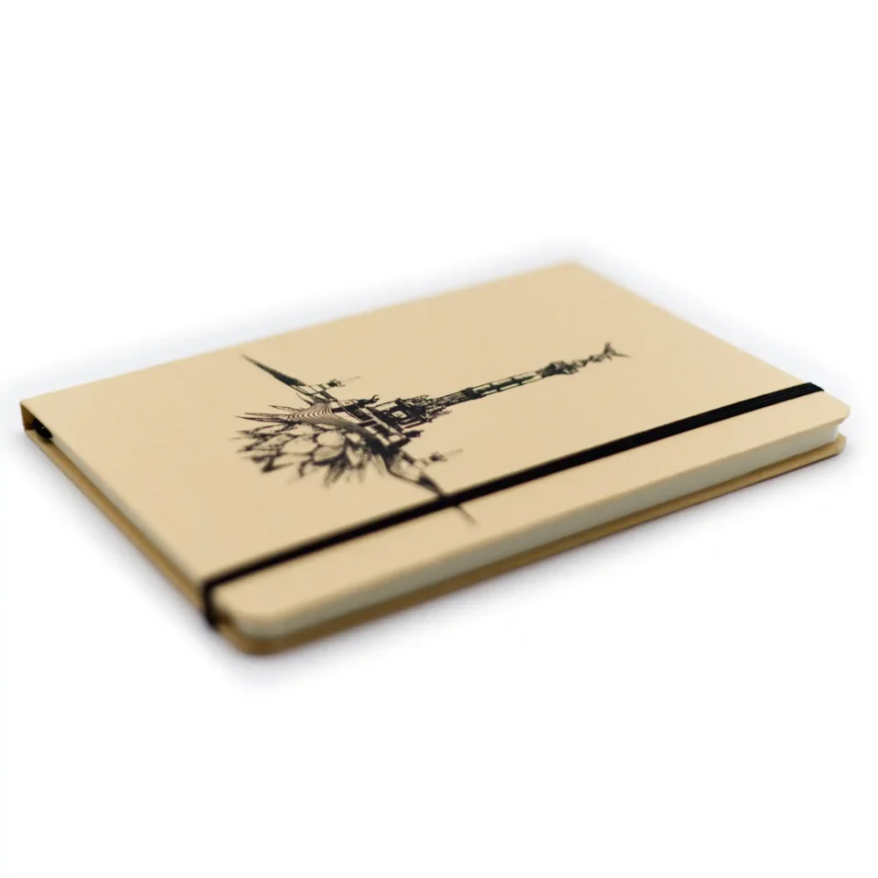 Isometric photo of Arena de Mazunte notebook with design inspired by the Angel of Independence.