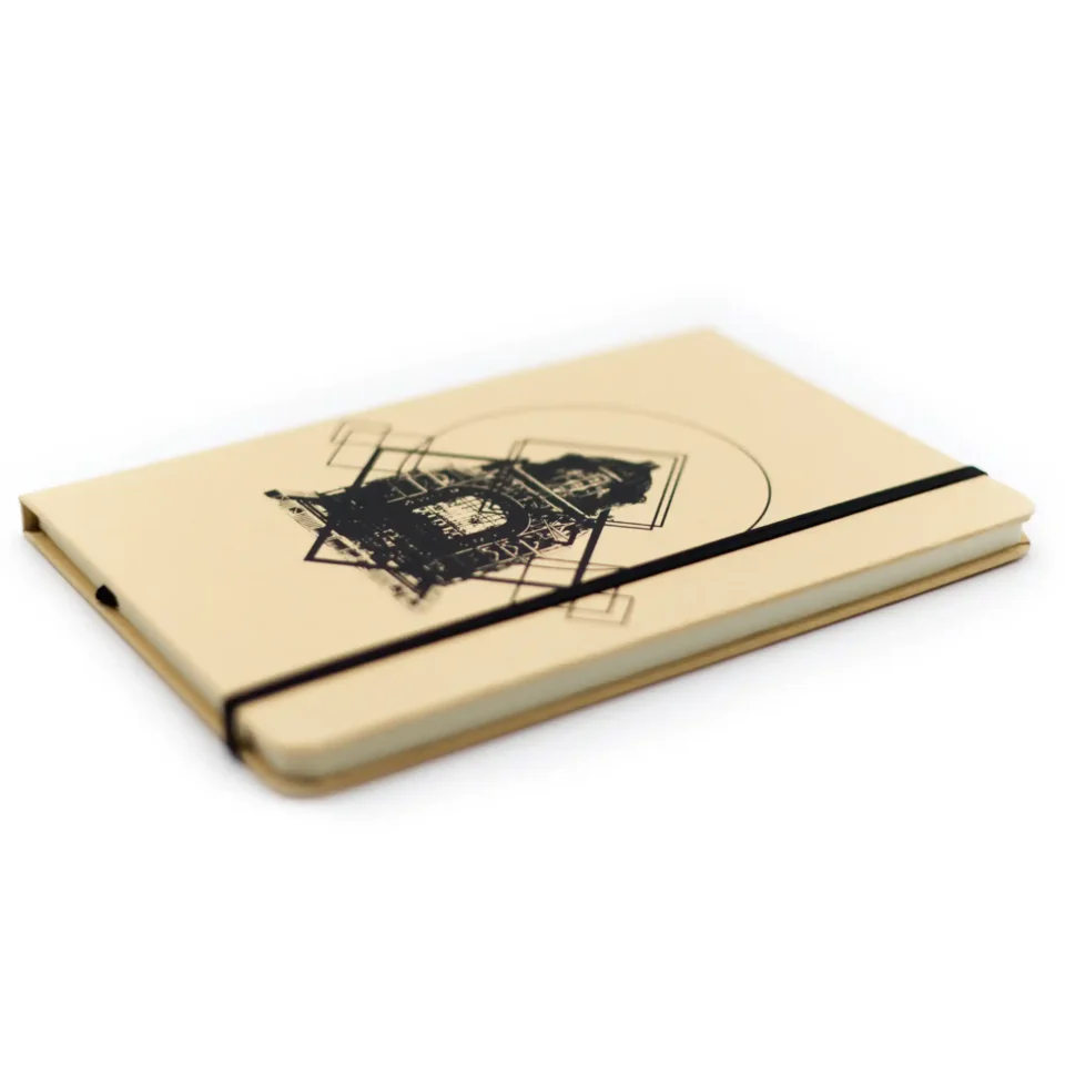 Isometric photo of Arena de Mazunte notebook with design inspired by the Monument to the Revolution.